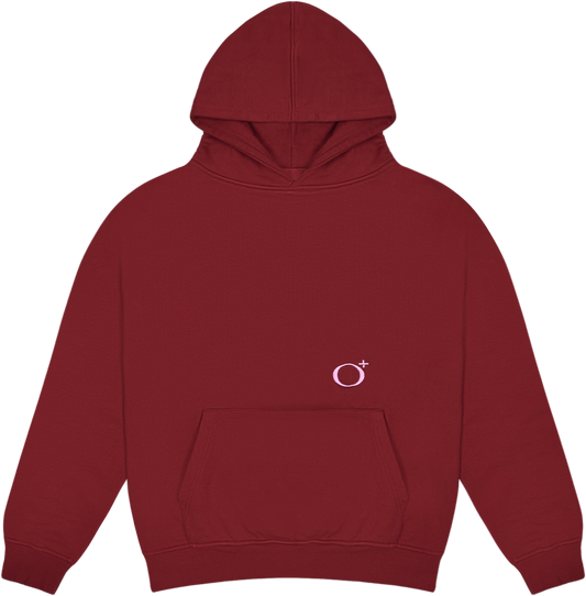 This is the Circleplus Hoodie in red / pink. It is laid flat in a uniform manner.